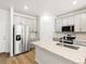 Modern kitchen features sleek stainless steel appliances, center island, and wood floors, creating a stylish cooking space at 742 N Tempe St, Aurora, CO 80018