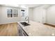 Bright and open floor plan showcasing a large kitchen island with modern sink and faucet fixtures at 742 N Tempe St, Aurora, CO 80018