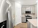 Modern kitchen featuring stainless steel appliances, stylish cabinets, and granite countertops at 742 N Tempe St, Aurora, CO 80018