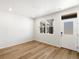 Bright living room features wood floors and a door, offering a versatile and welcoming space at 742 N Tempe St, Aurora, CO 80018