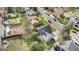 Aerial view of a charming home with a well-manicured lawn and a wooden deck in a quiet neighborhood at 7746 W Quarto Dr, Littleton, CO 80128