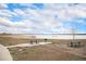 Enjoy outdoor gatherings in this picnic area with tables and a grill, set against the backdrop of a scenic lake at 7746 W Quarto Dr, Littleton, CO 80128