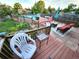 Inviting backyard with deck, seating, above-ground pool, and lush landscaping for outdoor living at 3216 S Granby Way, Aurora, CO 80014