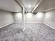 Spacious carpeted basement with neutral colors, ideal for customizable living space or entertainment at 3216 S Granby Way, Aurora, CO 80014