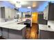 Updated kitchen with granite countertops, stainless appliances and blue accent lighting at 3216 S Granby Way, Aurora, CO 80014