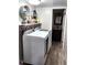 Functional laundry room with washer, dryer and access to a bathroom at 3216 S Granby Way, Aurora, CO 80014