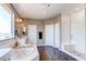 Spacious bathroom with a tub, separate glass shower, and a vanity with ample counter space at 1902 Pioneer Cir, Lafayette, CO 80026