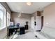 Inviting bedroom with a modern desk, comfortable seating, and ample natural light at 1902 Pioneer Cir, Lafayette, CO 80026