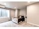 Bright bedroom boasts a comfy bed, neutral walls, and cozy carpet at 1902 Pioneer Cir, Lafayette, CO 80026