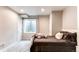Bedroom featuring neutral walls, carpeted flooring, and a comfy bed with brown bedding at 1902 Pioneer Cir, Lafayette, CO 80026