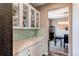Butler's pantry showcasing white cabinetry and stylish backsplash at 1902 Pioneer Cir, Lafayette, CO 80026