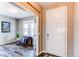 Bright entryway with a white front door and a view into the cozy office space at 1902 Pioneer Cir, Lafayette, CO 80026