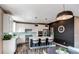 Modern kitchen with a center island, stainless appliances and stylish lighting fixtures at 1902 Pioneer Cir, Lafayette, CO 80026