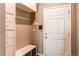 Organized mudroom entrance with built in cabinets, bench, and coat rack at 1902 Pioneer Cir, Lafayette, CO 80026