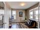 Office features hardwood flooring, bright windows, and flexible space for work or hobbies at 1902 Pioneer Cir, Lafayette, CO 80026