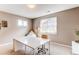 Bright office with large window, neutral colors, and a contemporary desk for productive workspace at 1902 Pioneer Cir, Lafayette, CO 80026