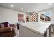 Versatile basement room with recessed lighting and a large table, ideal for hobbies or crafting at 2080 Shadow Creek Dr, Castle Rock, CO 80104
