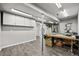 Well-equipped basement workshop featuring a variety of tools, overhead lighting, and ample storage at 2080 Shadow Creek Dr, Castle Rock, CO 80104