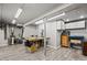 Functional basement workshop with lighting and a variety of tools, perfect for DIY enthusiasts at 2080 Shadow Creek Dr, Castle Rock, CO 80104