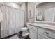 Neutral bathroom featuring a shower, toilet, vanity, and decorative accents at 2080 Shadow Creek Dr, Castle Rock, CO 80104