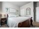 Relaxing bedroom featuring a luxurious bed, soft lighting, and calming artwork at 2080 Shadow Creek Dr, Castle Rock, CO 80104