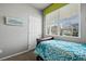 Comfortable bedroom with a blue floral comforter, window and natural light at 2080 Shadow Creek Dr, Castle Rock, CO 80104