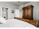 Primary bedroom suite with views to the ensuite bathroom, large closet, and wood furniture at 2080 Shadow Creek Dr, Castle Rock, CO 80104