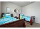 Inviting bedroom featuring two beds, soft carpeting, and cozy decor at 2080 Shadow Creek Dr, Castle Rock, CO 80104