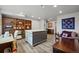 Spacious craft room with a large crafting table, shelving, and a comfortable seating area at 2080 Shadow Creek Dr, Castle Rock, CO 80104