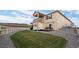 Two-story home boasts a well-maintained lawn, charming decks, and a serene landscape at 2080 Shadow Creek Dr, Castle Rock, CO 80104