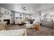 Bright living area with a fireplace, an open floor plan and plush furnishings at 2080 Shadow Creek Dr, Castle Rock, CO 80104