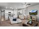 Open floor plan showcasing the living area flowing into the kitchen with stainless appliances at 2080 Shadow Creek Dr, Castle Rock, CO 80104