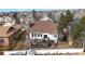 Aerial view of the backyard featuring a two-level deck, fenced yard, and mature trees at 11666 W 74Th Way, Arvada, CO 80005