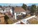 Aerial view showcases the home's two-story deck, fenced backyard, and landscaping at 11666 W 74Th Way, Arvada, CO 80005