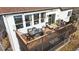 The back of the house features a spacious deck and a cozy screened-in porch at 11666 W 74Th Way, Arvada, CO 80005