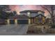 Charming two-story home featuring an attached three-car garage and beautifully landscaped front yard at 11666 W 74Th Way, Arvada, CO 80005