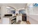 Kitchen with stainless steel appliances and view into common areas at 11666 W 74Th Way, Arvada, CO 80005