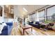 Bright living room with hardwood floors, skylight, and large windows at 11666 W 74Th Way, Arvada, CO 80005