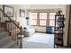 Bright living room featuring a sofa and large windows with natural light at 11666 W 74Th Way, Arvada, CO 80005