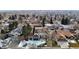 Aerial view of a neighborhood featuring mature trees and well-maintained homes in a quiet setting at 11666 W 74Th Way, Arvada, CO 80005