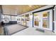 Cozy sunroom with plenty of light, seating, and neutral colored rug at 11666 W 74Th Way, Arvada, CO 80005
