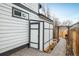 Backyard storage shed and paver walkway along the white house with charcoal trim at 9094 W 103Rd Ave, Broomfield, CO 80021