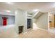 Basement with stairs to a bathroom and under-stair storage area and shelving at 9094 W 103Rd Ave, Broomfield, CO 80021