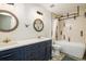 This bathroom features double sinks with designer fixtures, decorative tile floors, and a modern tub at 9094 W 103Rd Ave, Broomfield, CO 80021