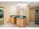 Bathroom featuring a double vanity with teal countertop and a checkerboard floor at 9094 W 103Rd Ave, Broomfield, CO 80021