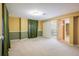 Bedroom with olive and tan color scheme with closet, slider closet and a door to the bathroom at 9094 W 103Rd Ave, Broomfield, CO 80021
