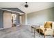 This bedroom showcases vaulted ceilings, plush carpeting, and a rustic barn door leading to a bathroom at 9094 W 103Rd Ave, Broomfield, CO 80021