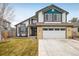 Charming two-story home with well-maintained lawn and attached two-car garage at 9094 W 103Rd Ave, Broomfield, CO 80021