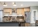 Modern kitchen featuring stainless steel appliances and a spacious island at 9094 W 103Rd Ave, Broomfield, CO 80021