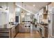Modern kitchen with stainless steel appliances, granite countertops, and sleek cabinetry at 9094 W 103Rd Ave, Broomfield, CO 80021